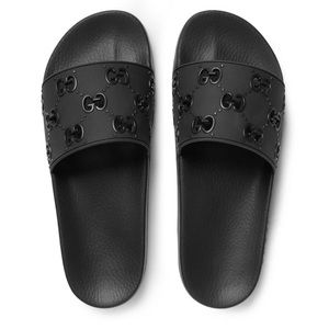 GUCCI BLACK RUBBER SLIDES..